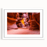 Abstract art print of Antelope Canyon in Arizona, showing swirling rock formations in earth tones on a white framed canvas.