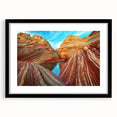 Colorful abstract art print of Arizona's Coyote Buttes on textured canvas, framed in black, ideal for living room decor.