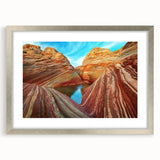 Textured art of Arizona's Coyote Buttes in muted earth tones on a framed silver mat, suitable for bedroom decor.