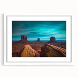 Abstract art print of Monument Valley in muted earth tones on a framed white mat, suitable for bedroom or dining room decor.