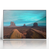 Acrylic print of Monument Valley with earth tones and a white frame, suitable for modern art wall decor.