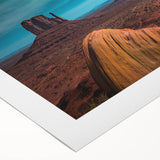 Art deco poster of Monument Valley in muted earth tones on rolled canvas, suitable for dining room decor.