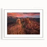 Abstract art print of Sedona landscape in muted earth tones on a framed white mat, ideal for dining room decor.