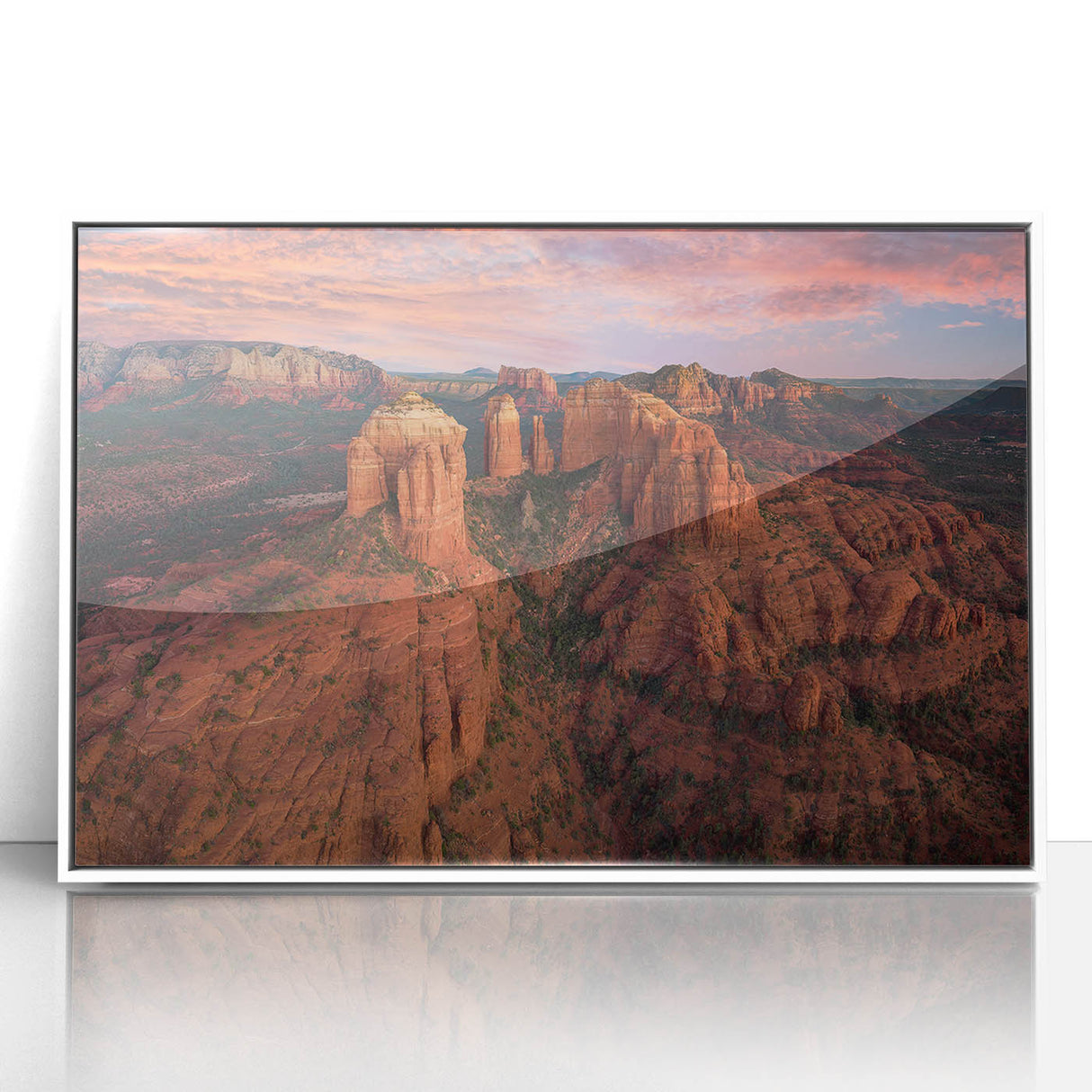 Acrylic print of Sedona landscape with vibrant red and orange tones, framed in white, suitable for modern art wall decor.