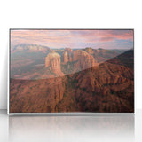 Acrylic print of Sedona landscape with vibrant red and orange tones, framed in white, suitable for modern art wall decor.