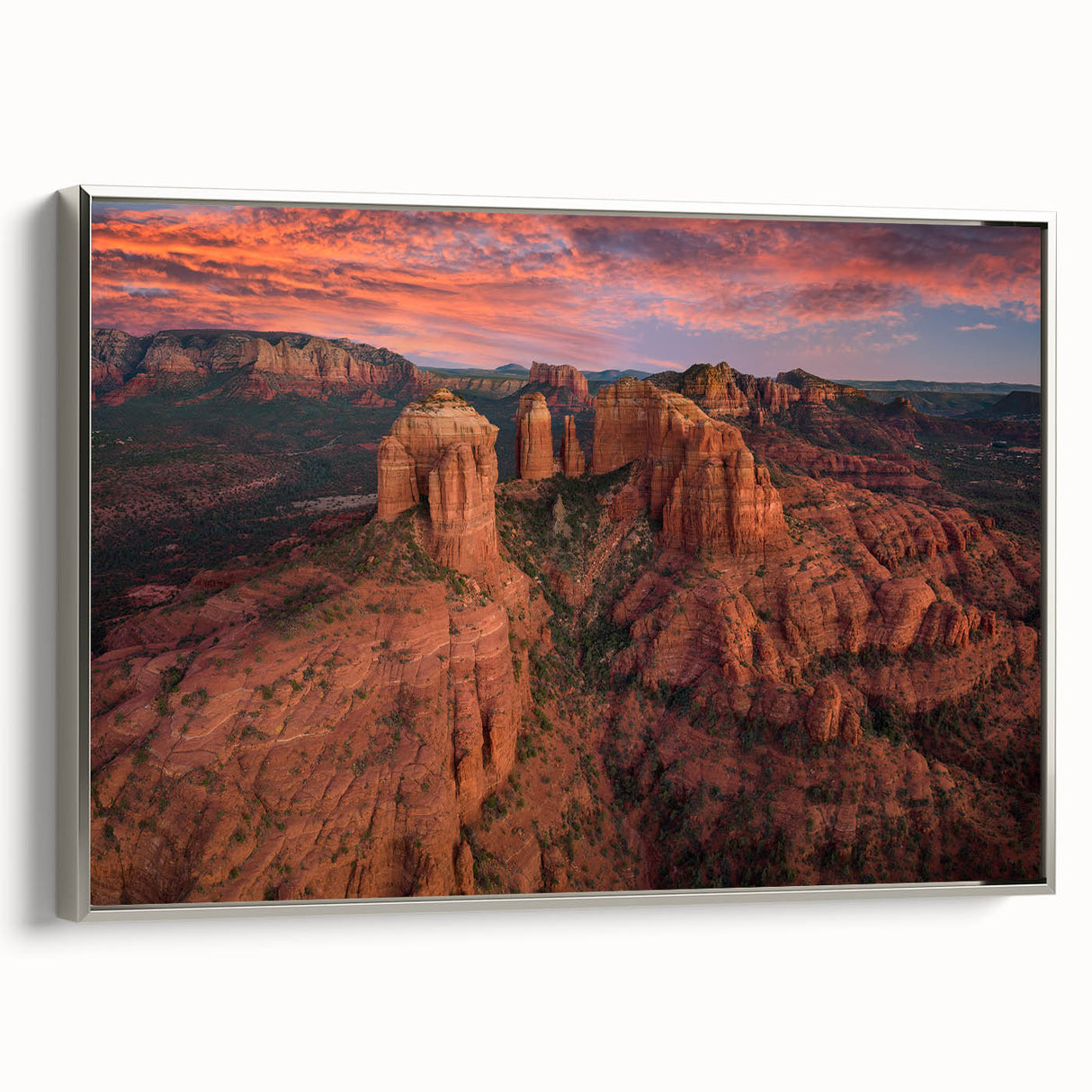 Landscape art painting of Sedona, Arizona, featuring a colorful palette on a silver-framed canvas.