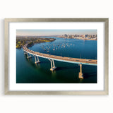Textured abstract art print depicting Coronado, California in muted blue and green hues on a framed silver mat.