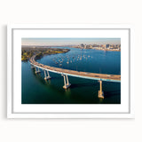Abstract art print of Coronado, California in muted blue and gray tones on a white framed mat, ideal for dining room decor.