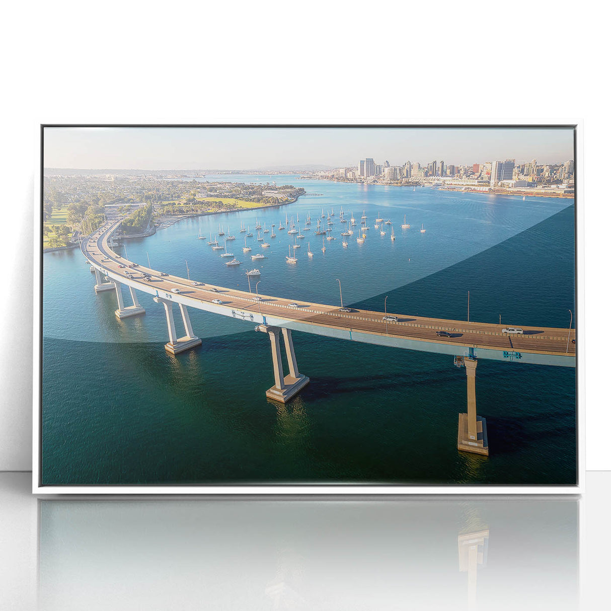 Art deco poster featuring the Coronado, California skyline in muted blue and white tones on a framed acrylic.