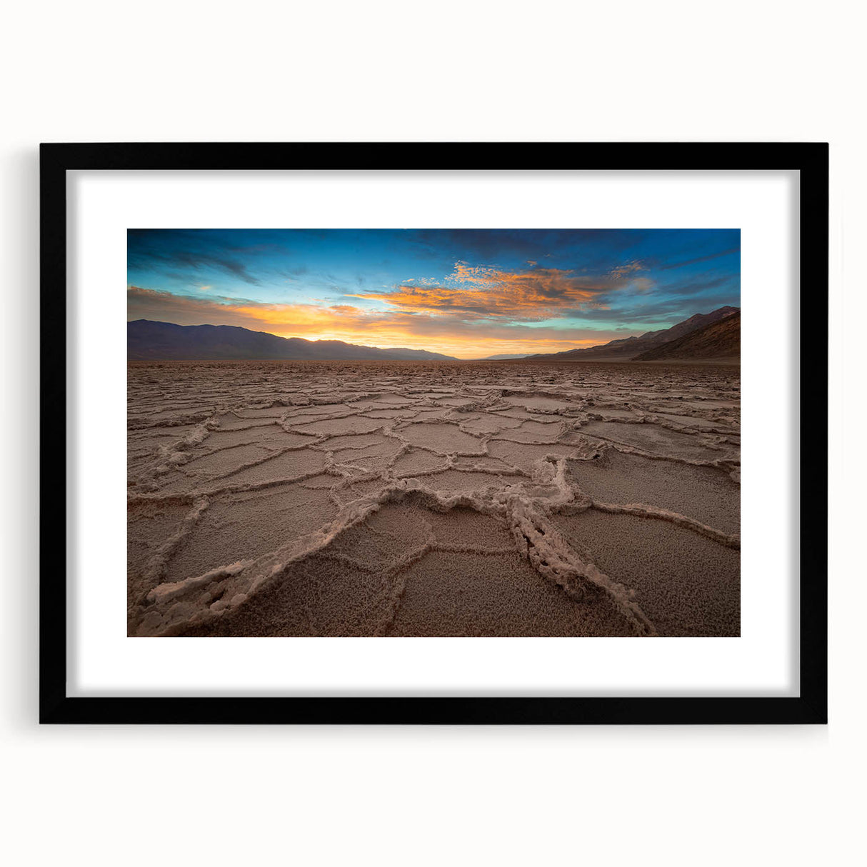 Extra large framed wall art of an abstract Death Valley scene with textured, colorful art in vibrant hues.