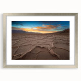Textured art of Death Valley in muted earth tones on a silver-framed matte canvas, suited for bedroom decor.