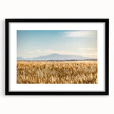 Abstract art print depicting Pikes Peak in vibrant, textured colors on a large framed canvas, suitable for living room decor.