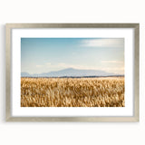Textured abstract art print of Pikes Peak in muted earth tones on a framed silver mat, suitable for bedroom art.