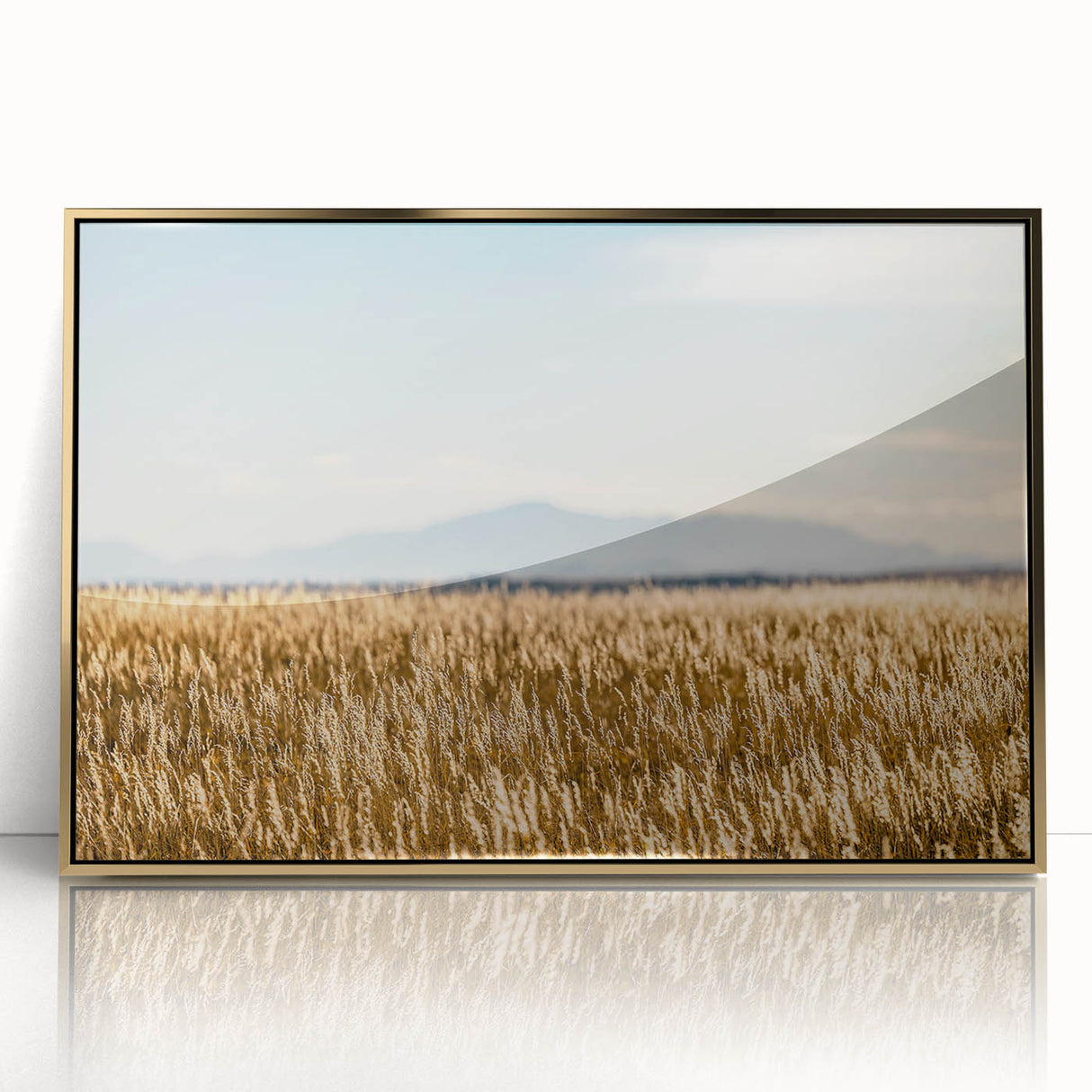 Acrylic print of Pikes Peak with gold frame, featuring muted earth tones, ideal for modern art wall decor.
