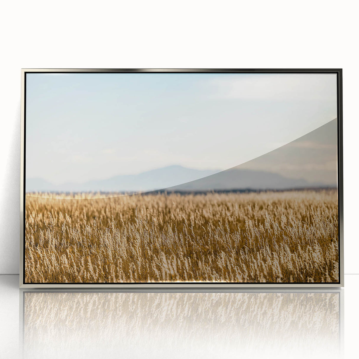 Mid-century modernist art depicting Pikes Peak, Colorado, in muted earth tones on a silver-framed acrylic print.