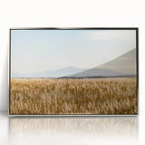 Mid-century modernist art depicting Pikes Peak, Colorado, in muted earth tones on a silver-framed acrylic print.