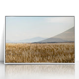 Acrylic print of Pikes Peak in muted earth tones, framed in white, suitable for modern art wall decor.