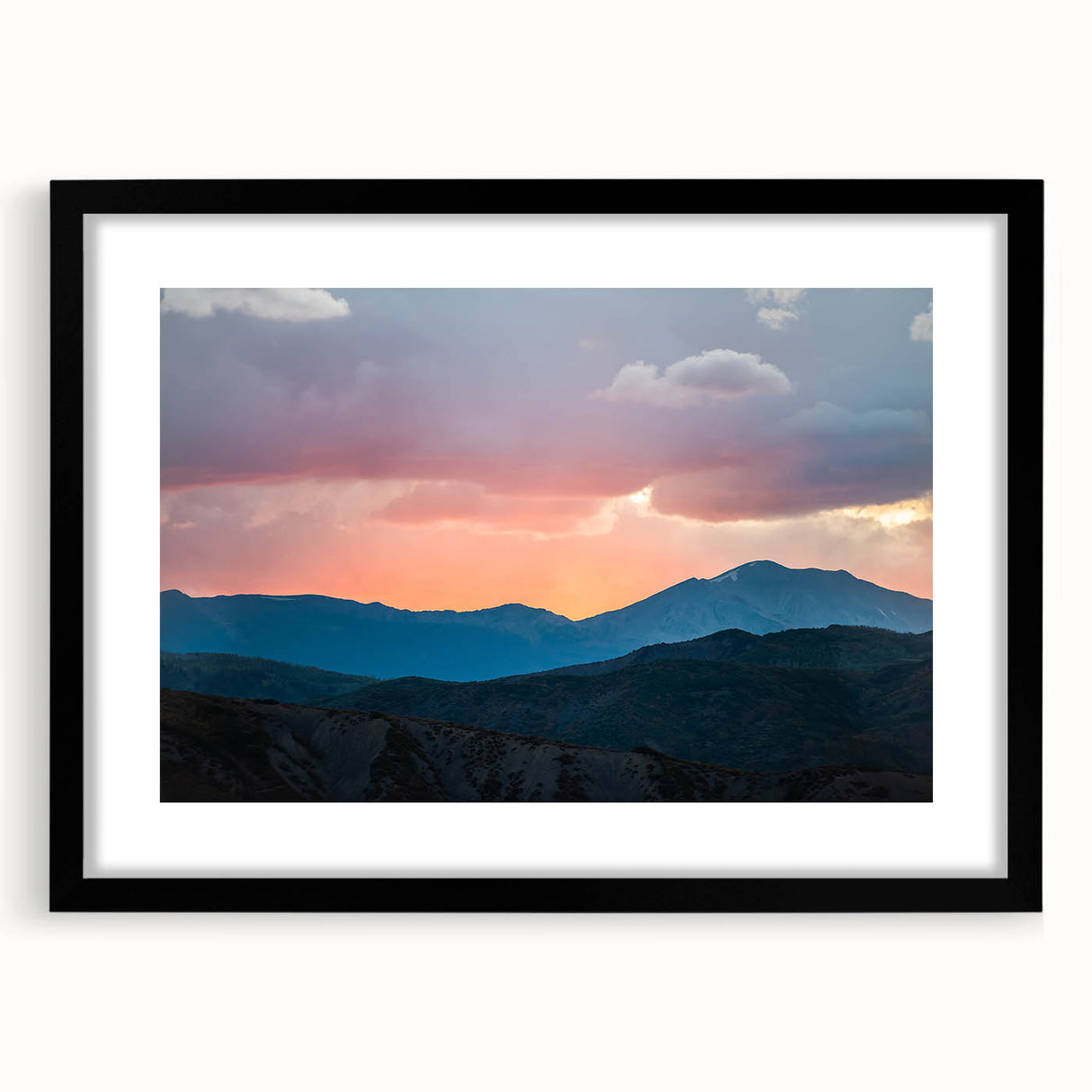 Extra large, textured abstract art print of colorful Rocky Mountains, framed in black, ideal for living room decor.