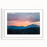 Abstract art print of the Rocky Mountains in muted earth tones on a framed white mat, ideal for dining room decor.