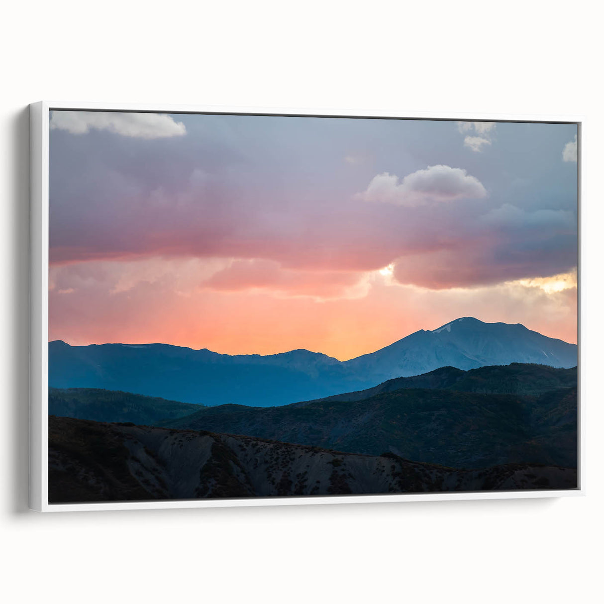 Vintage poster art of the Rocky Mountains on a framed canvas, featuring a blend of vibrant and muted earth tones.