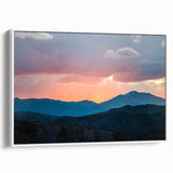 Vintage poster art of the Rocky Mountains on a framed canvas, featuring a blend of vibrant and muted earth tones.