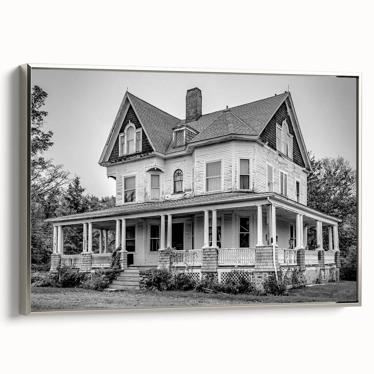 Framed canvas featuring a vintage-style Connecticut landscape in black with colorful accents, ideal for living room decor.