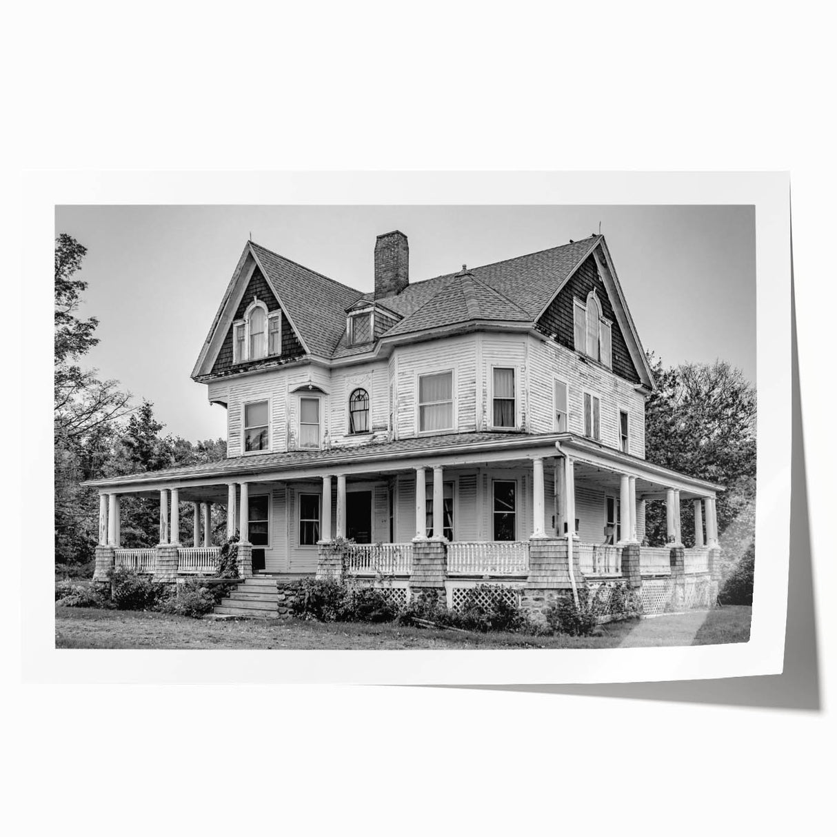 Rolled print of a serene Connecticut landscape featuring lush greenery and a calm river, ideal for dining room wall art.