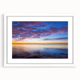 Abstract art print of the Florida Keys in muted blue and green tones, framed with a white mat, ideal for dining room decor.