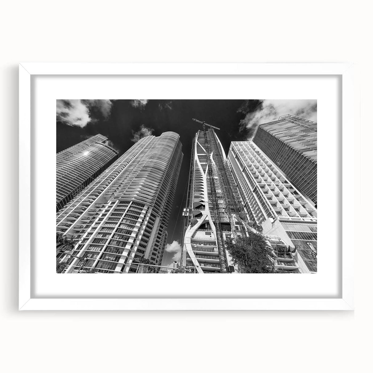 Abstract art print of Miami skyline in pastel shades on a framed white mat, suitable for bedroom or dining room decor.