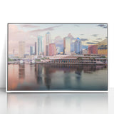 Framed acrylic print of Tampa skyline with pastel shades, ideal for modern art wall decor in a nursery.