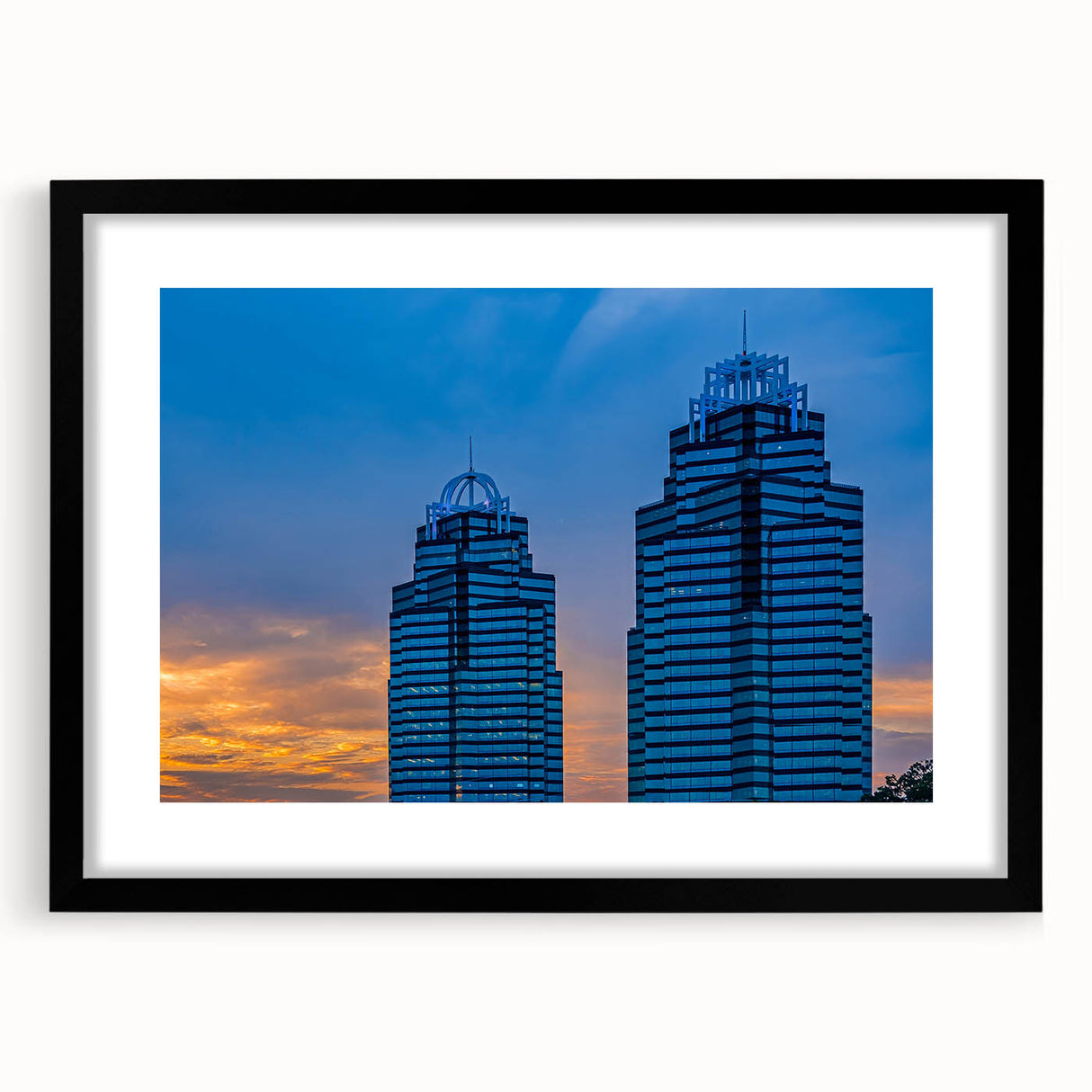 Colorful abstract art print of Atlanta skyline in vibrant hues on a large framed canvas, suitable for living room decor.