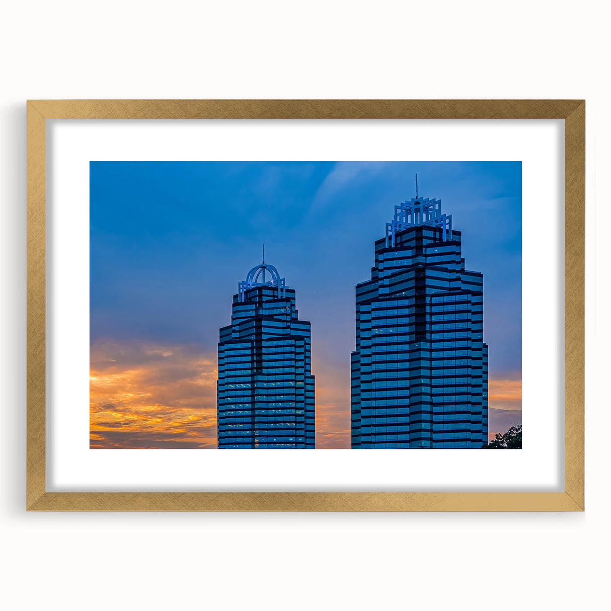 Extra large abstract art print of Atlanta skyline in muted gray and blue tones on a gold-framed canvas.
