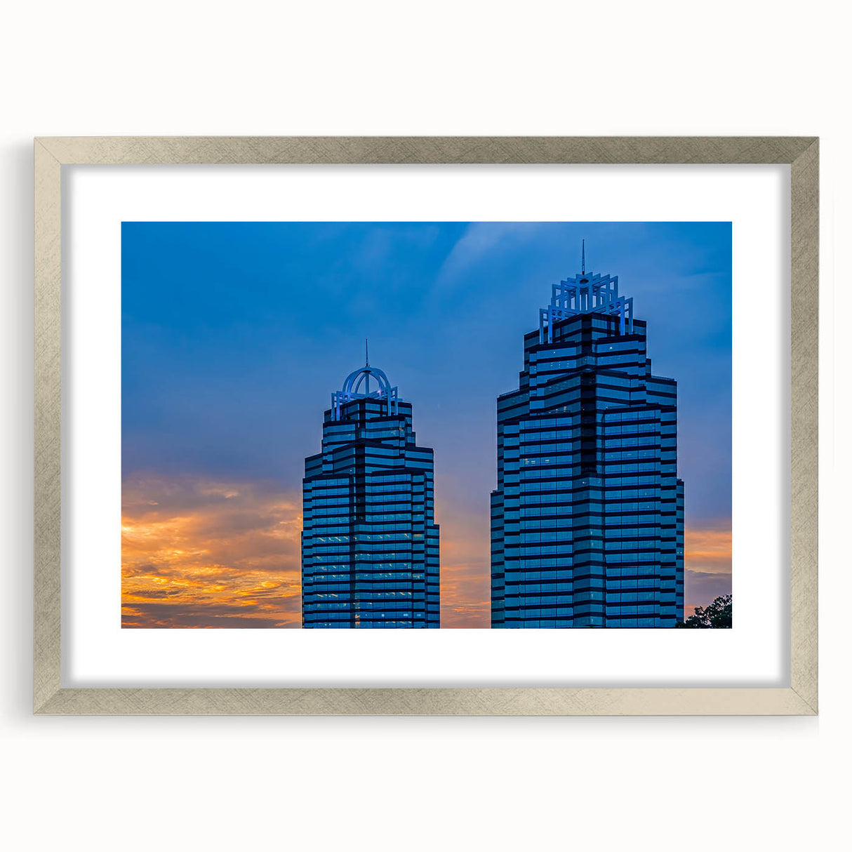 Textured abstract art print of the Atlanta skyline in pastel shades on a framed silver mat, suitable for bedroom decor.