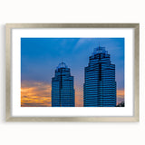 Textured abstract art print of the Atlanta skyline in pastel shades on a framed silver mat, suitable for bedroom decor.
