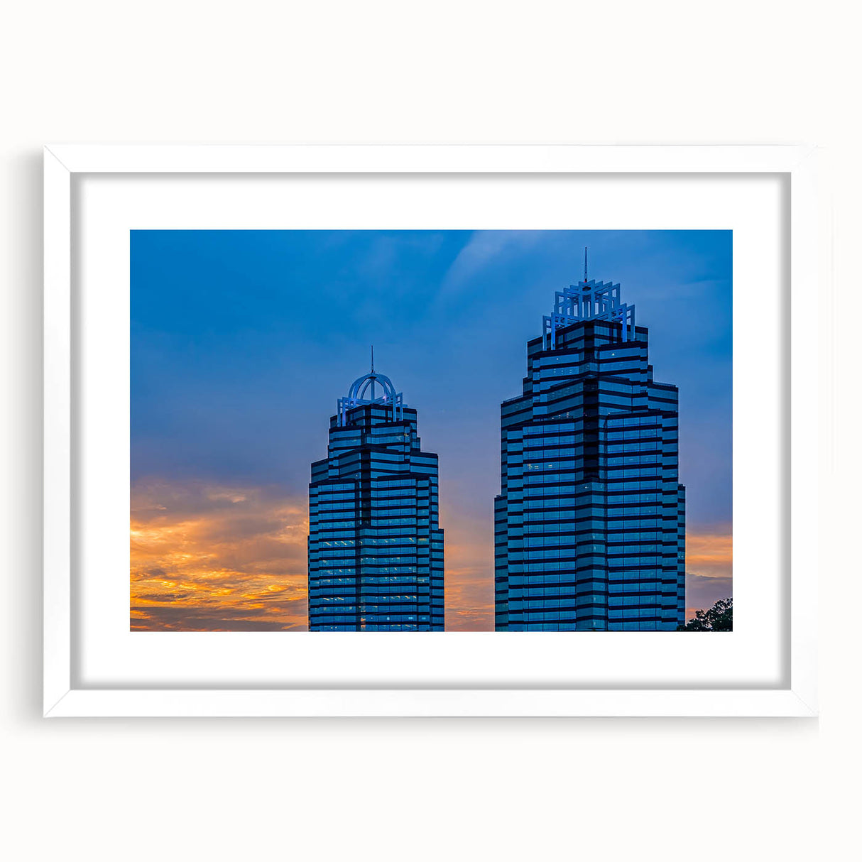 Abstract art print of Atlanta skyline in muted gray and blue tones on a framed white mat, ideal for dining room decor.
