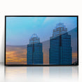 Large abstract wall art depicting the Atlanta skyline in muted gray and blue tones on a framed acrylic panel.