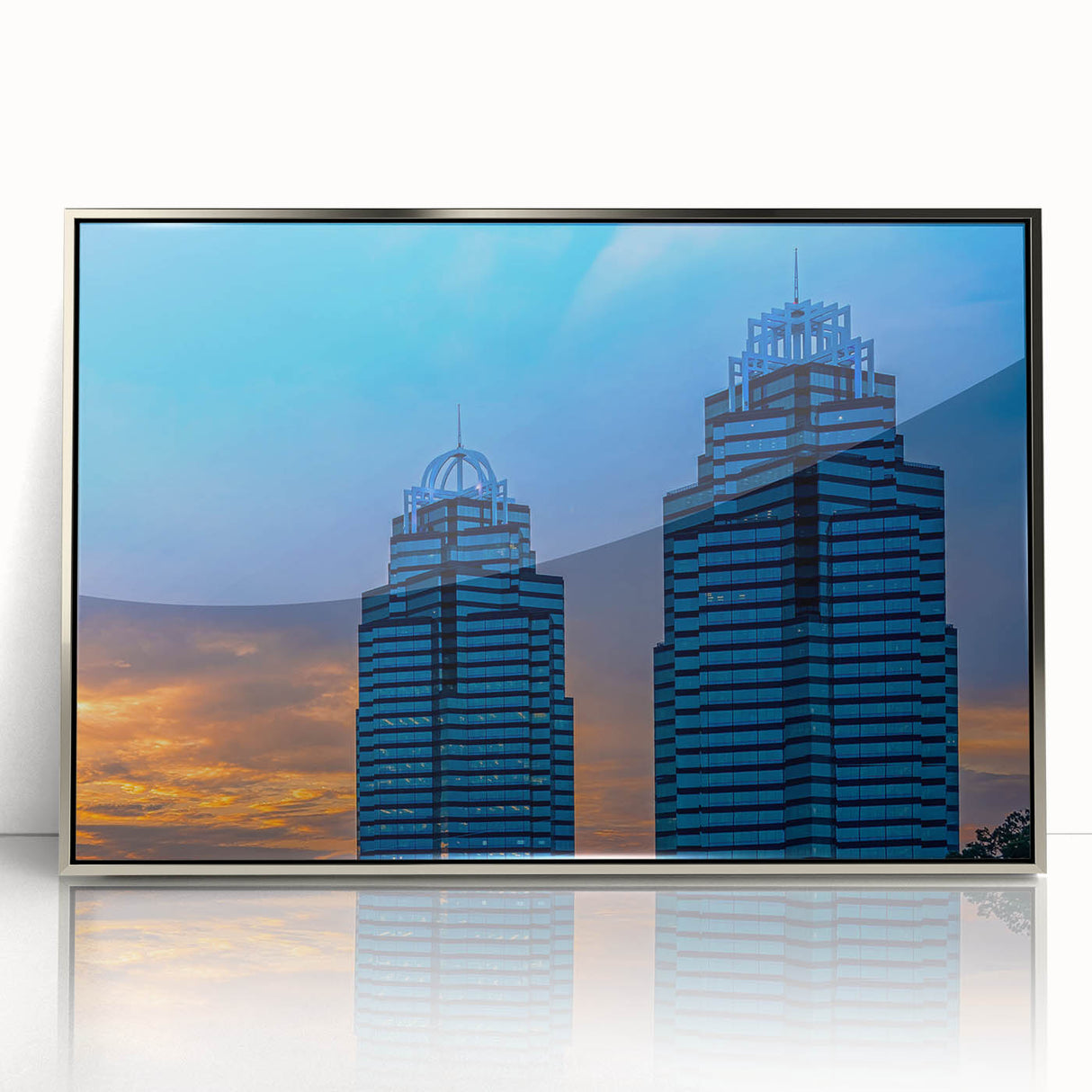 Mid-century modernist art of Atlanta skyline in silver acrylic frame, using a palette of cool blues and grays.
