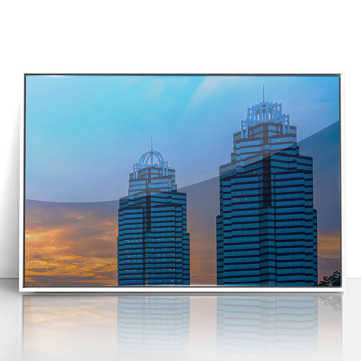 Art Deco style poster of Atlanta skyline, with muted gray and blue tones, framed in white acrylic.