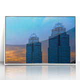 Art Deco style poster of Atlanta skyline, with muted gray and blue tones, framed in white acrylic.