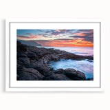 Abstract art print of Kauai landscape in muted green and blue tones, framed with a white mat, suitable for dining room decor.