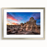 Textured art depicting an abstract Kansas landscape in muted earth tones on a framed silver mat, suitable for bedroom decor.