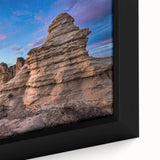 A close-up of extra large black wall art featuring a textured, colorful Kansas scenery on a framed canvas.
