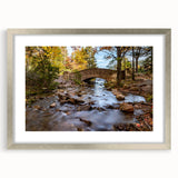 Textured abstract art print depicting Acadia, Maine in muted earth tones, framed in silver, ideal for bedroom wall decor.