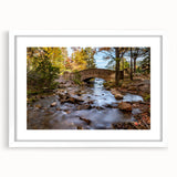 Abstract art print of Acadia in Maine with muted earth tones on a white framed canvas, suitable for dining room decor.
