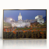 Acrylic print of Baltimore skyline in gold and blue tones, framed, mid-century modernist style.
