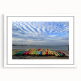 Abstract art print of Nantucket scenery in muted blue tones on a white framed poster, suitable for dining room decor.