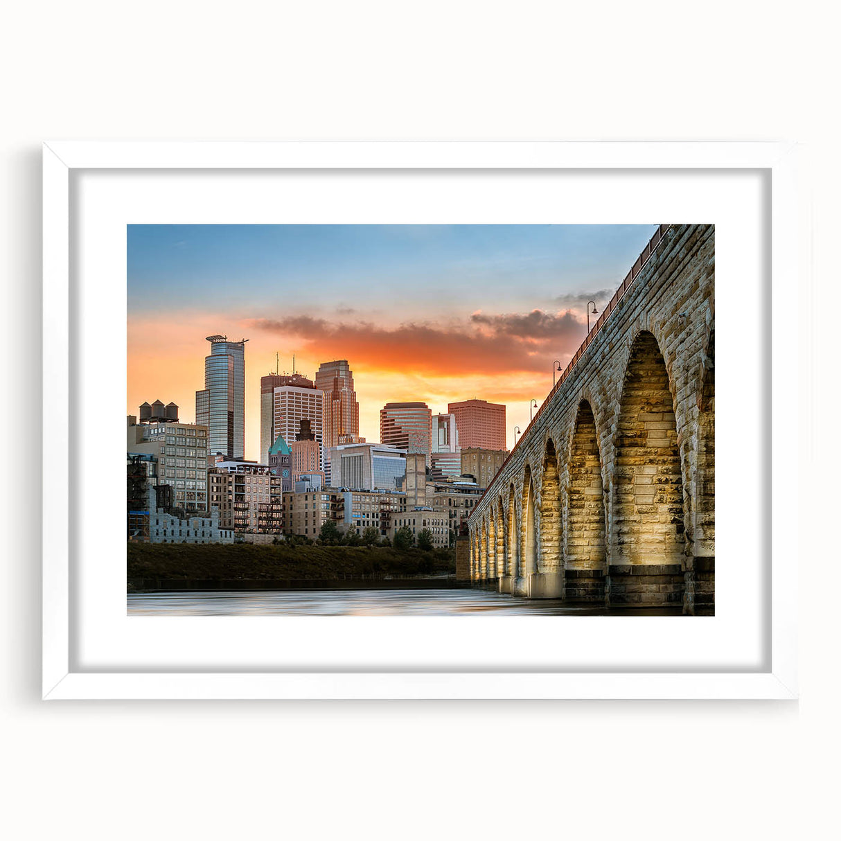 Abstract art print of Minneapolis skyline in muted gray and blue tones on a framed white mat, ideal for dining room decor.
