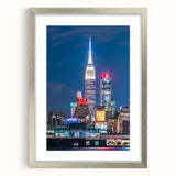 Textured abstract art print of Kansas City skyline in muted gray and blue tones on a framed canvas.