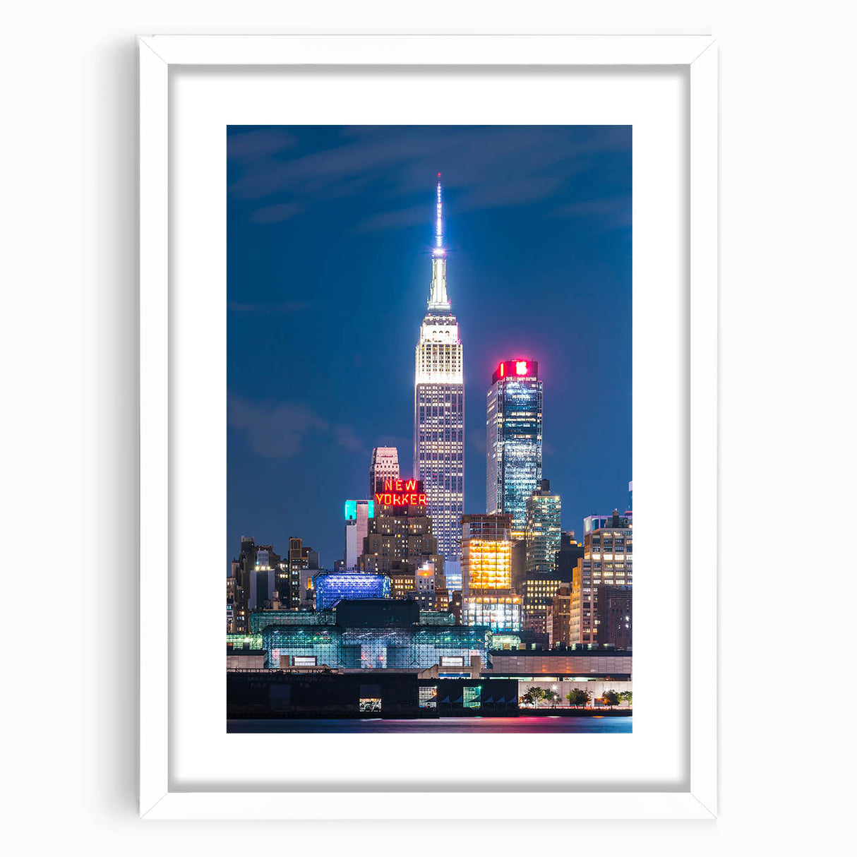 Abstract art print of Kansas City skyline in muted gray and blue tones on a framed white mat, ideal for dining room decor.