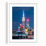 Abstract art print of Kansas City skyline in muted gray and blue tones on a framed white mat, ideal for dining room decor.